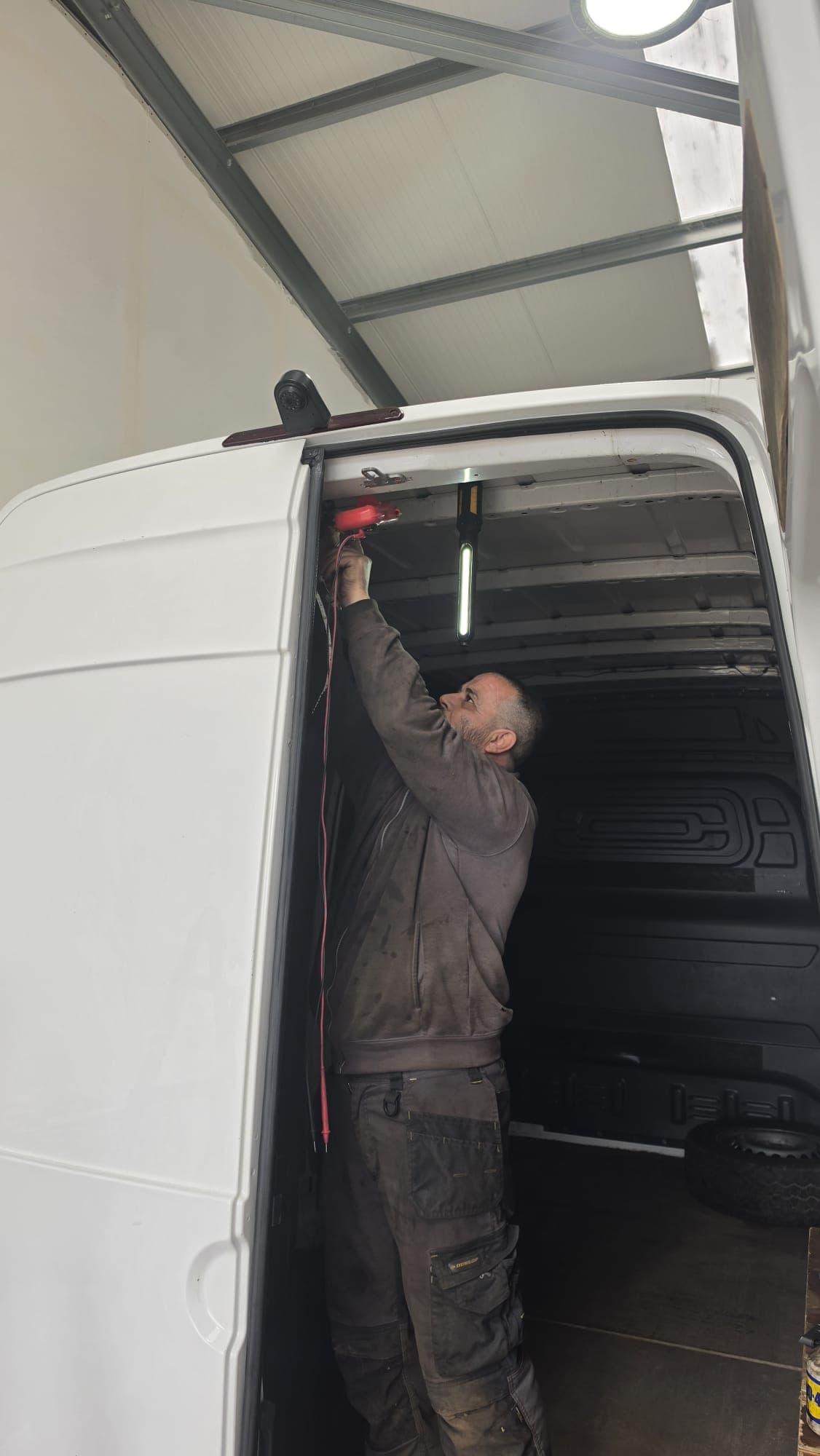 Technician working on brakes and suspension